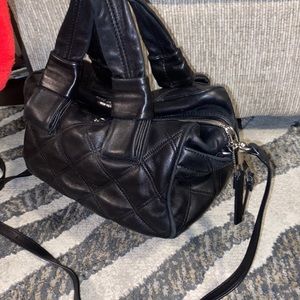 Lamb leather Marc Jacobs hand bag can be worn over shoulder or hand held